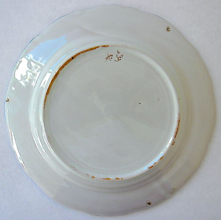 A plate of earthenware decorated with a cornucopia in St. Clement's earthenware