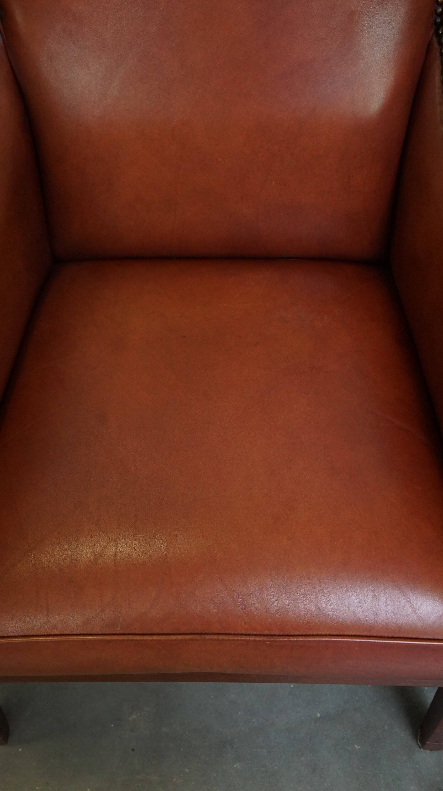 Ensemble majestueux et luxueux de 4 fauteuils design Art Déco en cuir de vachette couleur cognac