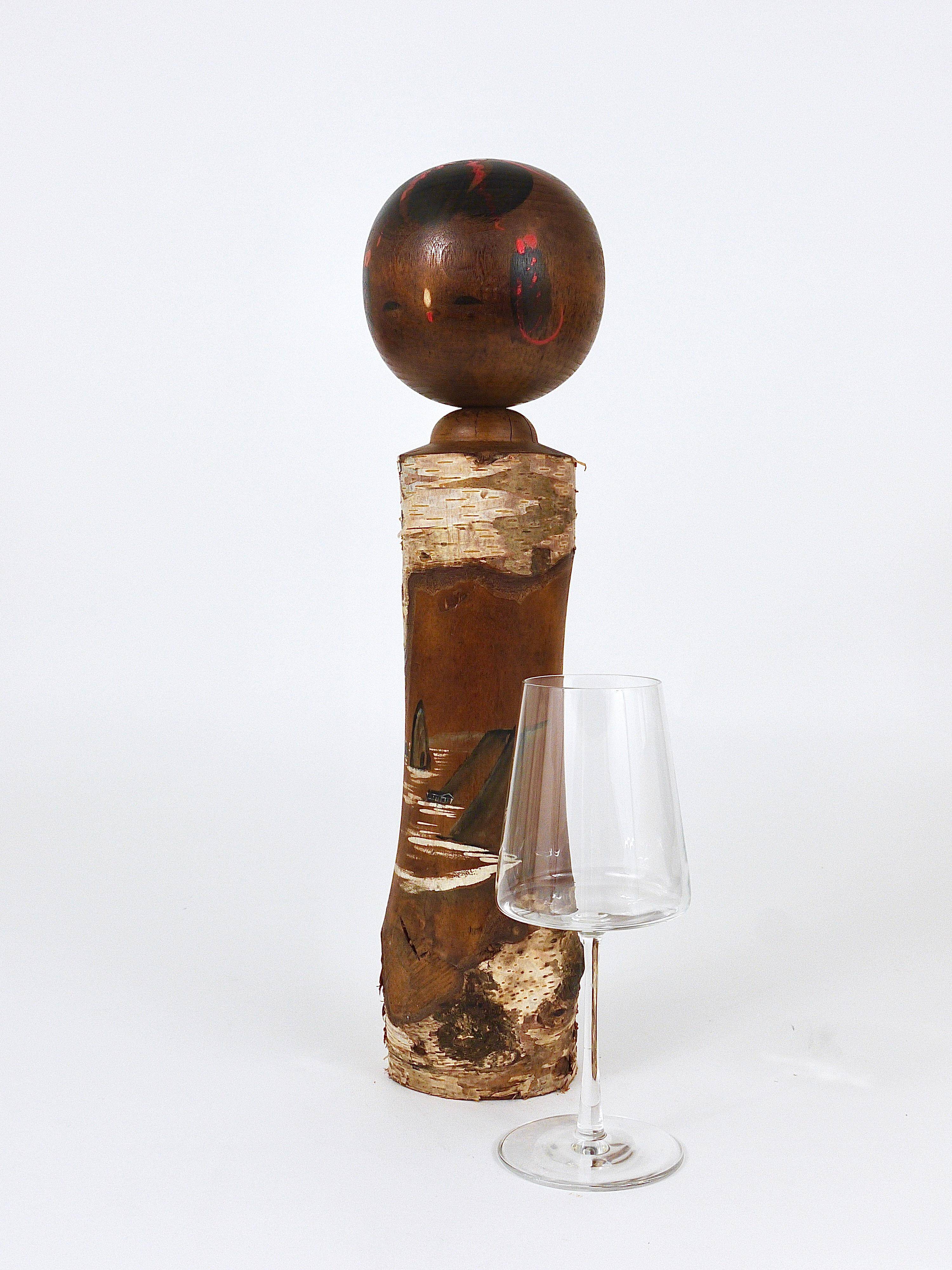 Decorative Kokeshi doll sculpture from northern Japan, hand-painted.