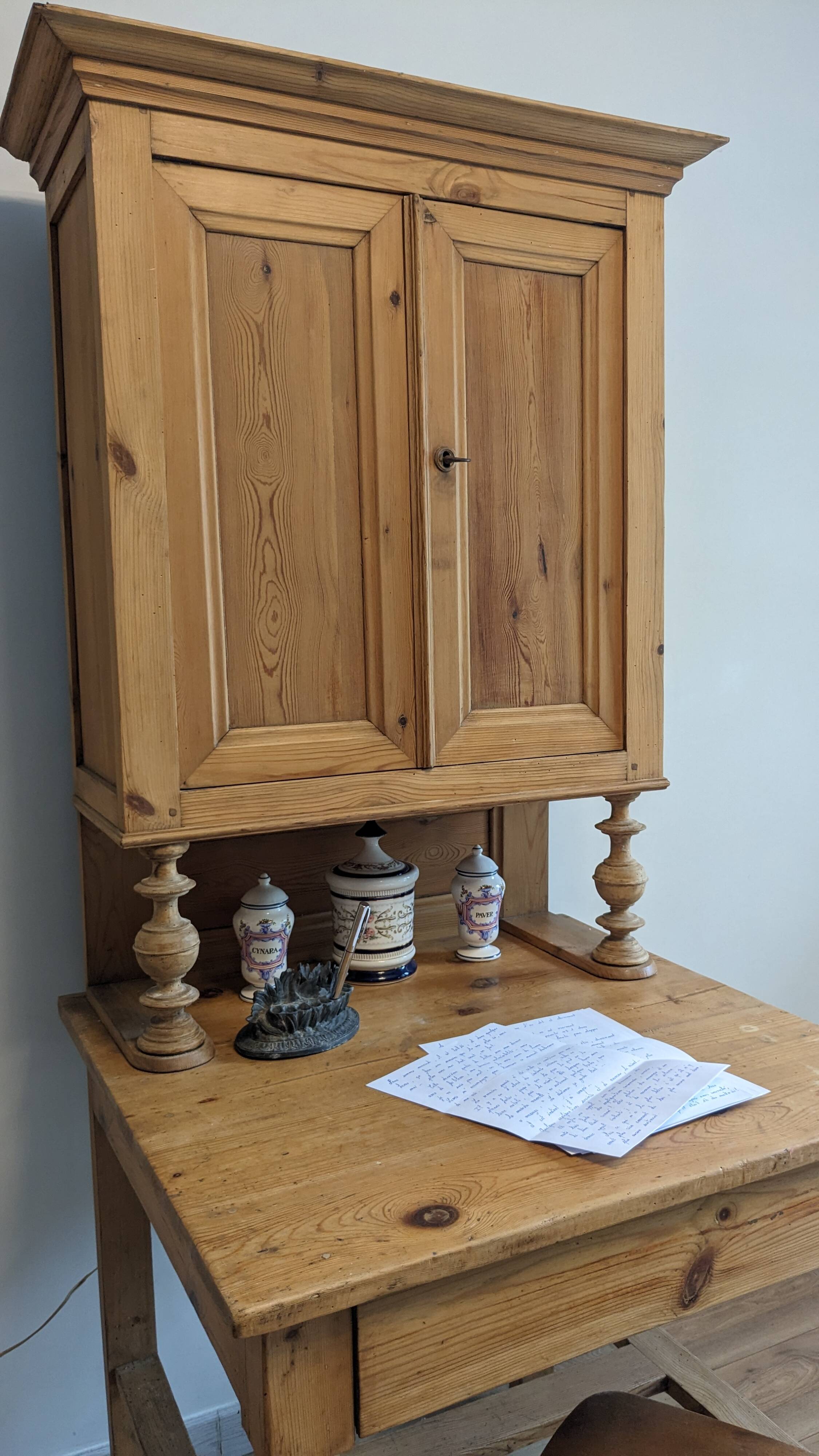 Former campaign secretary's desk in solid pine with a high cupboard.