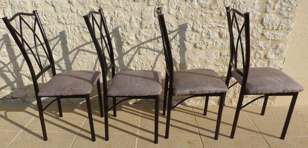 4 black metal chairs with high backs and gray suede tops