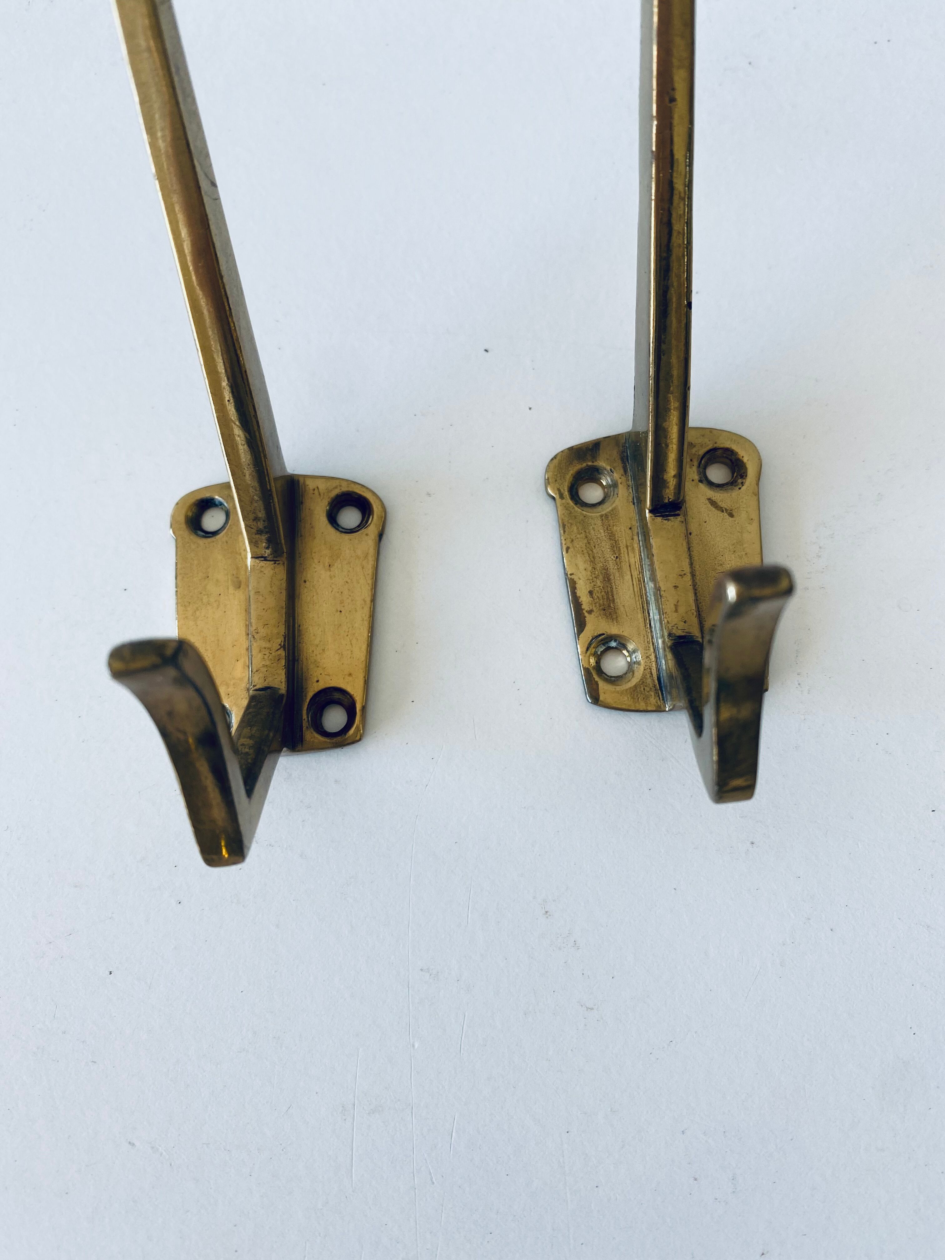 Pair of vintage brass hooks