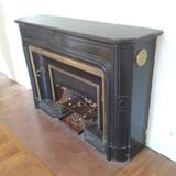 Fireplace XVIII° black marble louis XIV style with narrowed and floor slabs