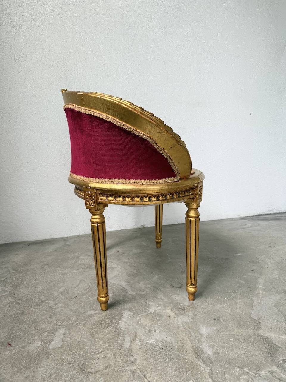 Louis XVI gilt wood and red velvet armchair