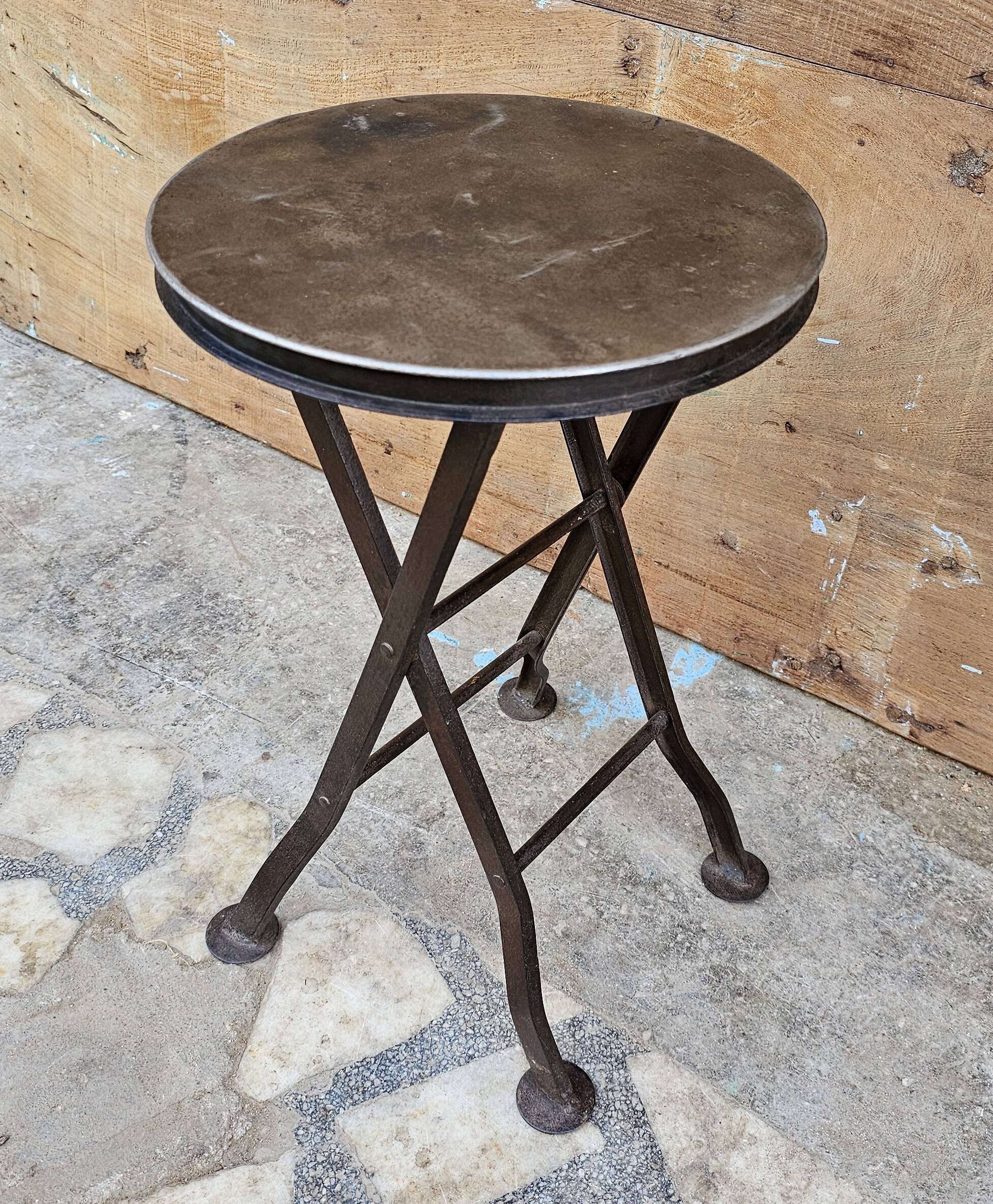 Old industrial folding steel stool