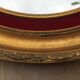 Miroir ovale en bois doré 76 x 67 cm