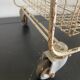 Metal serving trolley on wheels