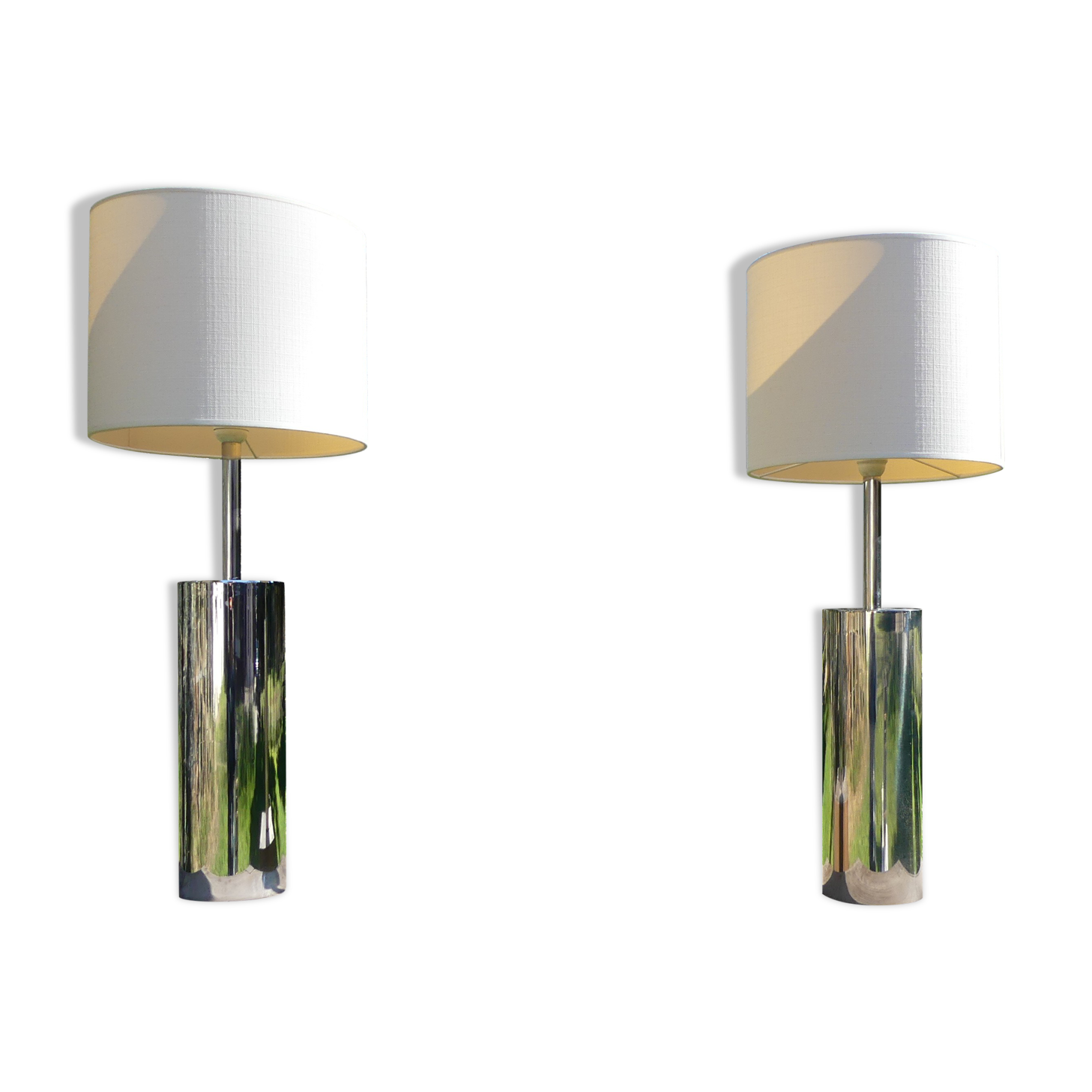 Foot of chrome lamps and ivory white lampshade