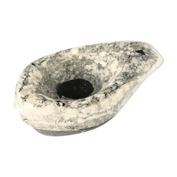 Brutalist marble ashtray in a free form.