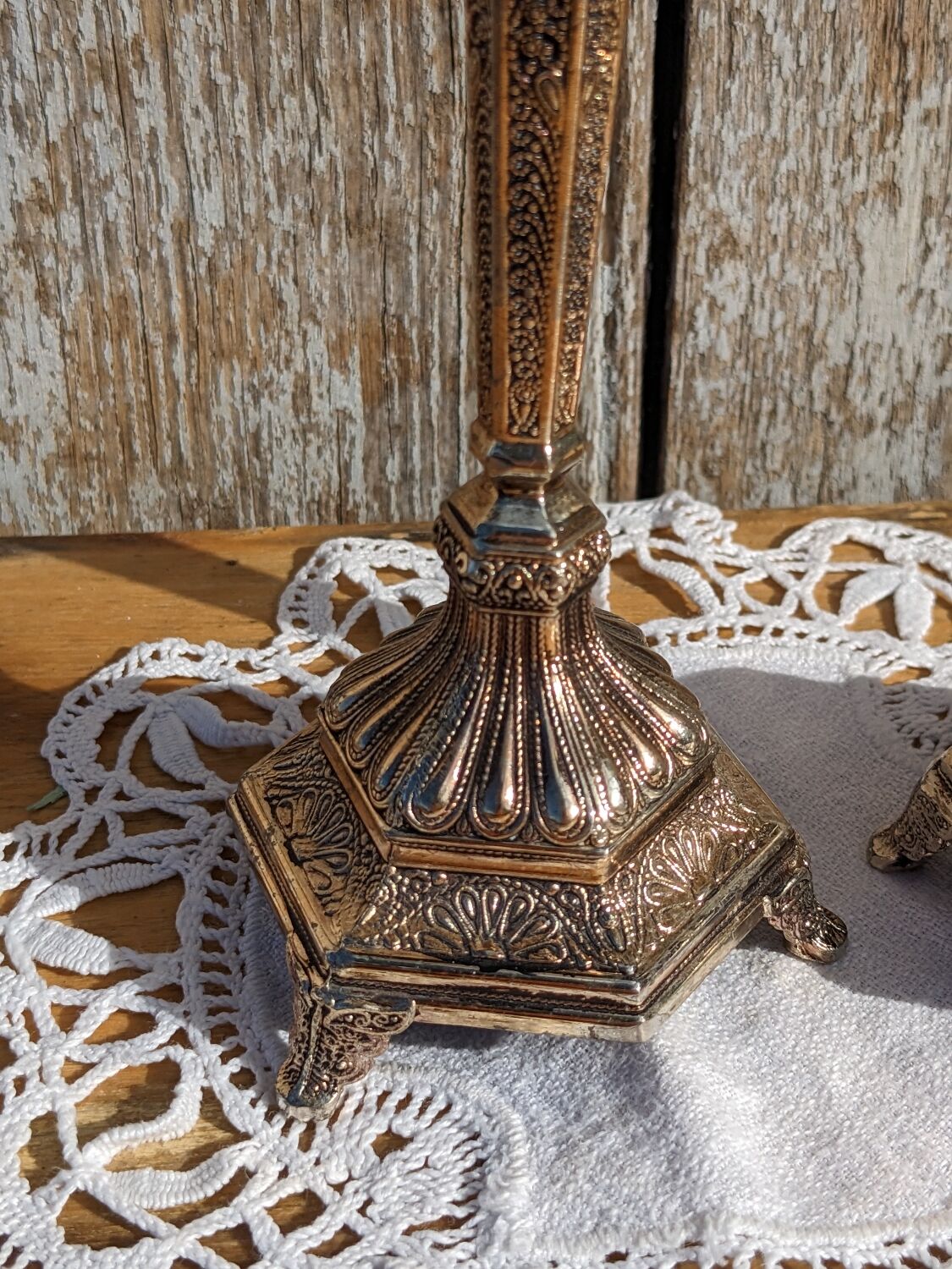 Pair of chiseled metal candle holders