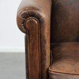 Vintage sheepskin armchair with warm colours and a characterful appearance
