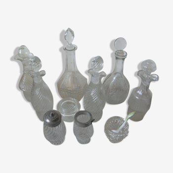 Lot of carafes and various glass bottles