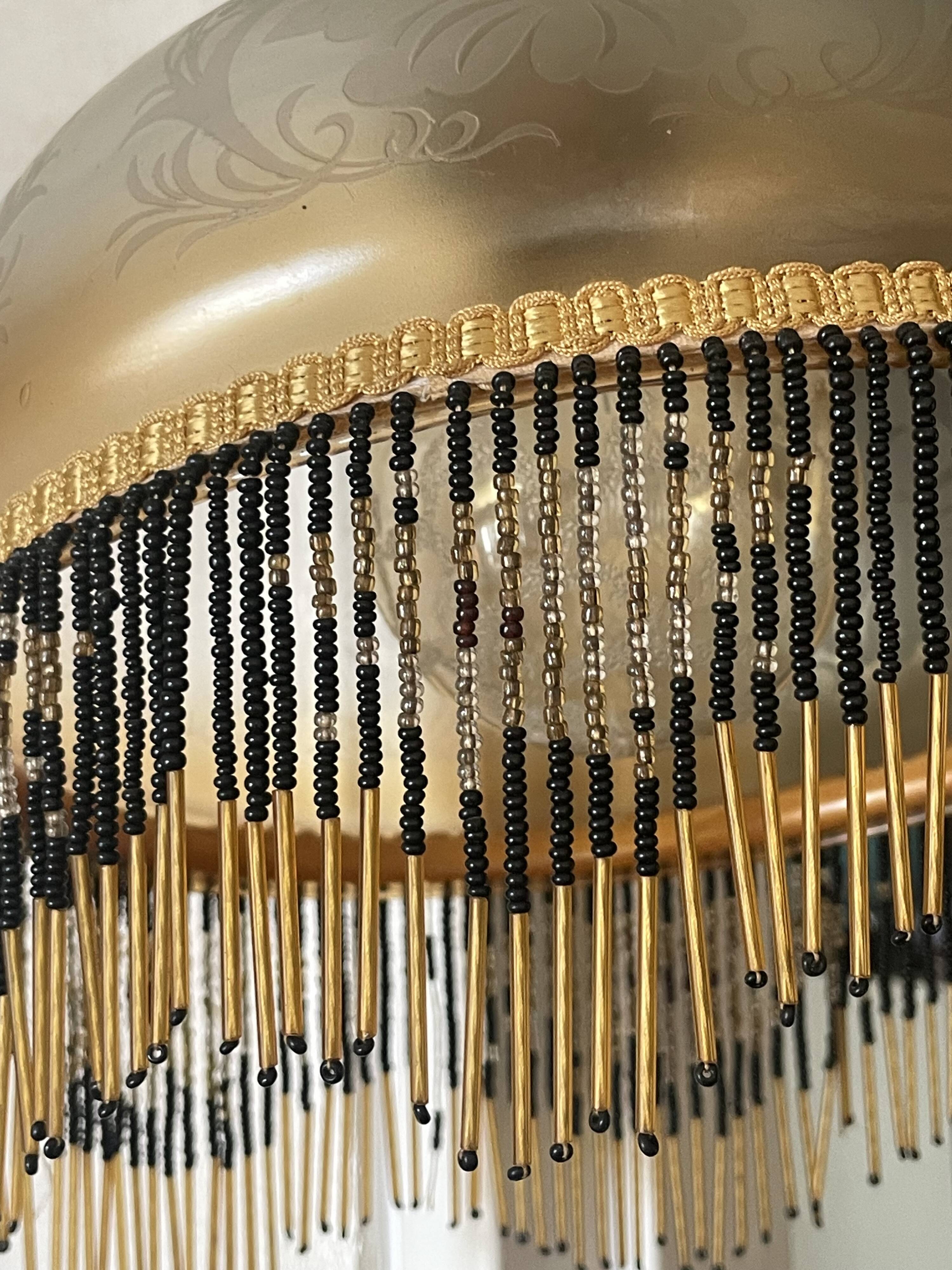 Glass lampshade and pearl tassels