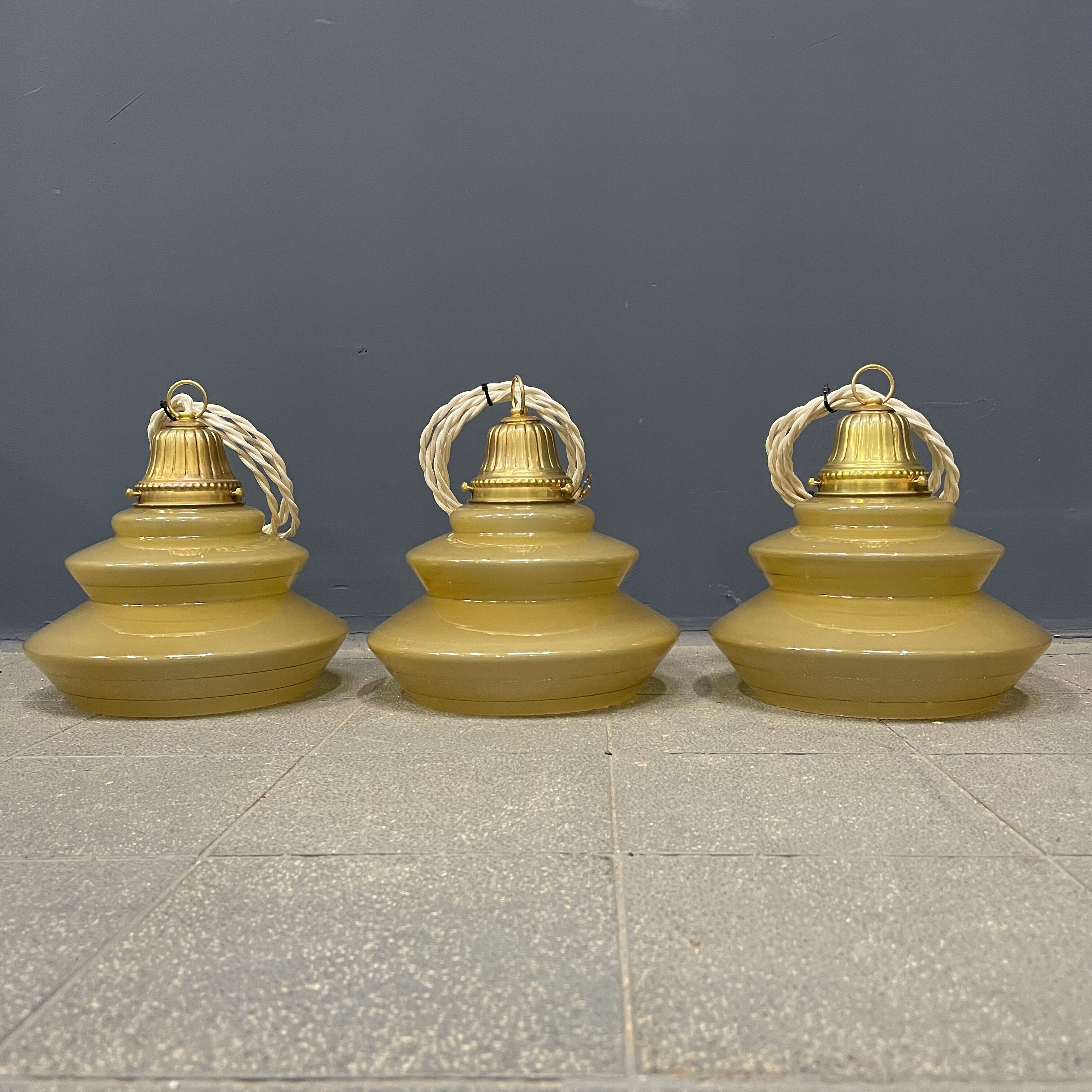 Vintage ocher glass hanging lamps with brass gallery