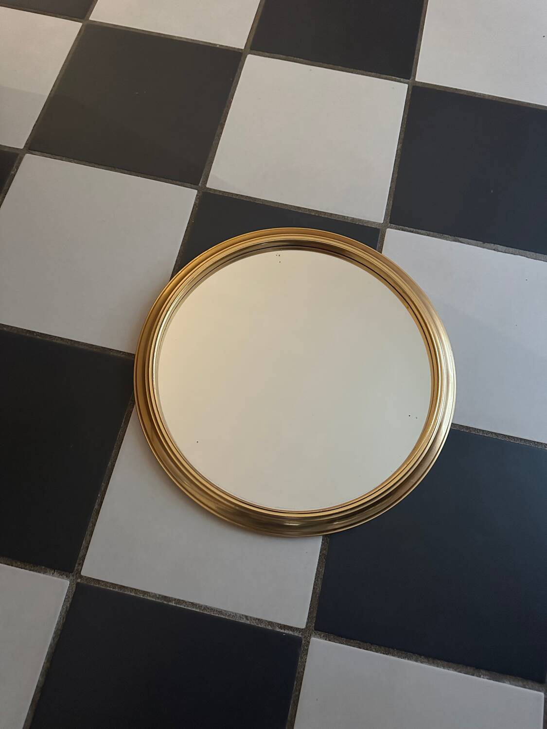 Round golden mirror