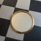 Round golden mirror