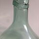 Transparent old demijohn about 8 to 10 L