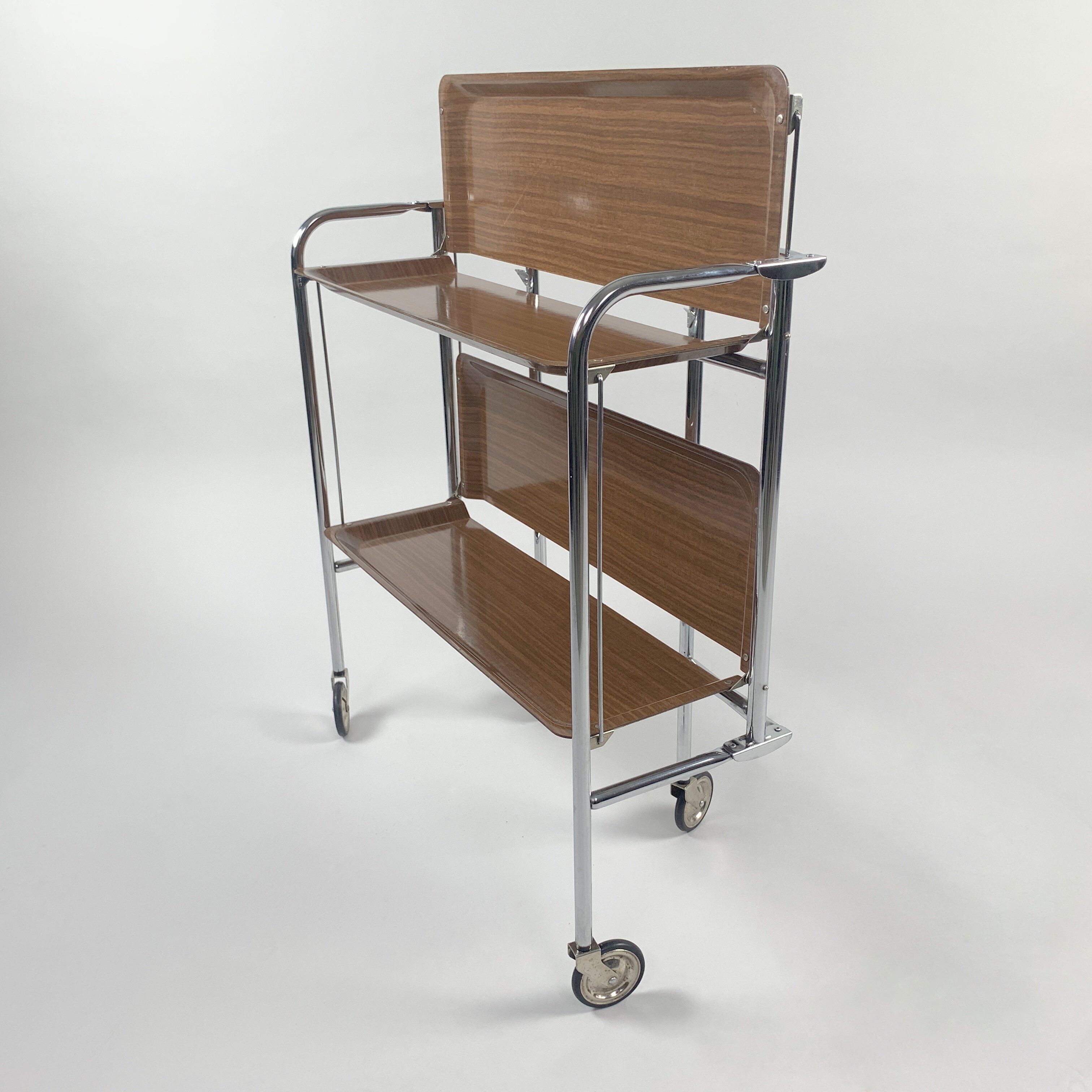 Chrome and laminated wood folding serving trolley, 1950