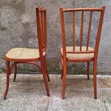 Pair of wooden and cane bistro chairs