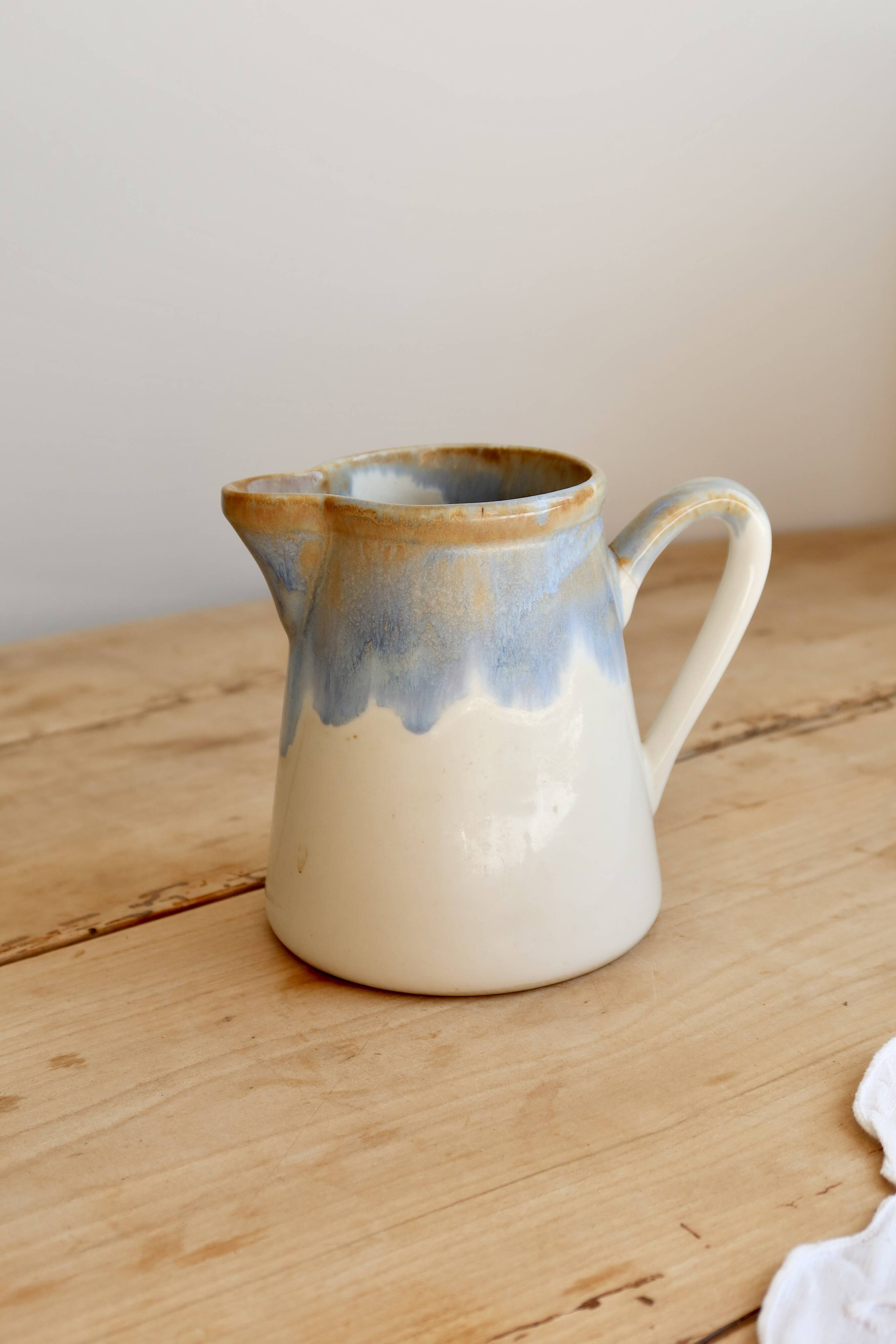 Vintage ceramic milk jug with a blue and taupe gradient glaze.