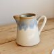 Vintage ceramic milk jug with a blue and taupe gradient glaze.