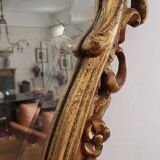 Beveled mirror and gilded wood