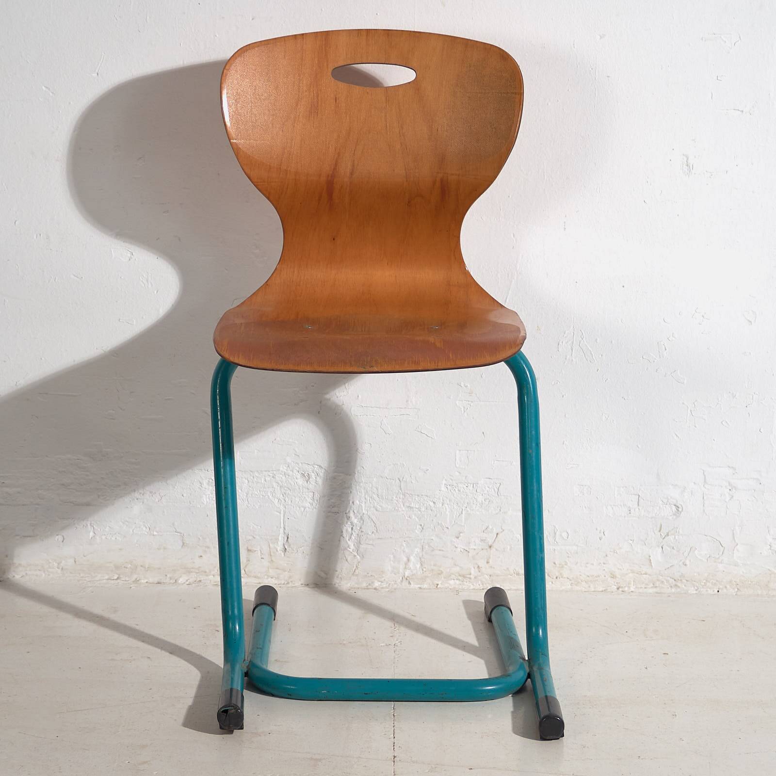 Vintage turquoise blue school chairs (c.1950). Set of 4 pieces