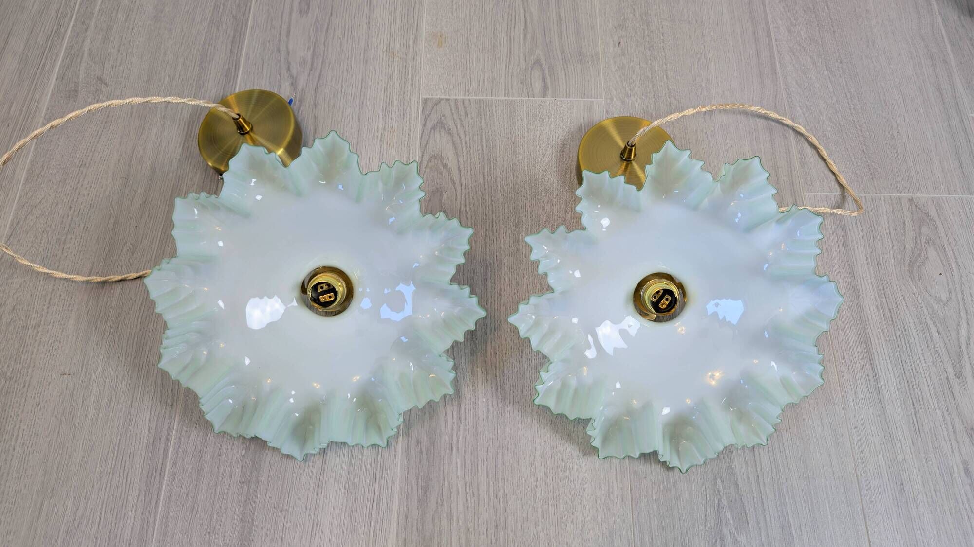 Pair of green opaline glass pendant lights – frosted poetry & Art Deco brilliance