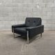 Pair of black leather armchairs