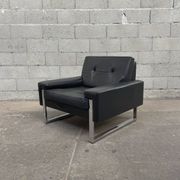 Pair of black leather armchairs