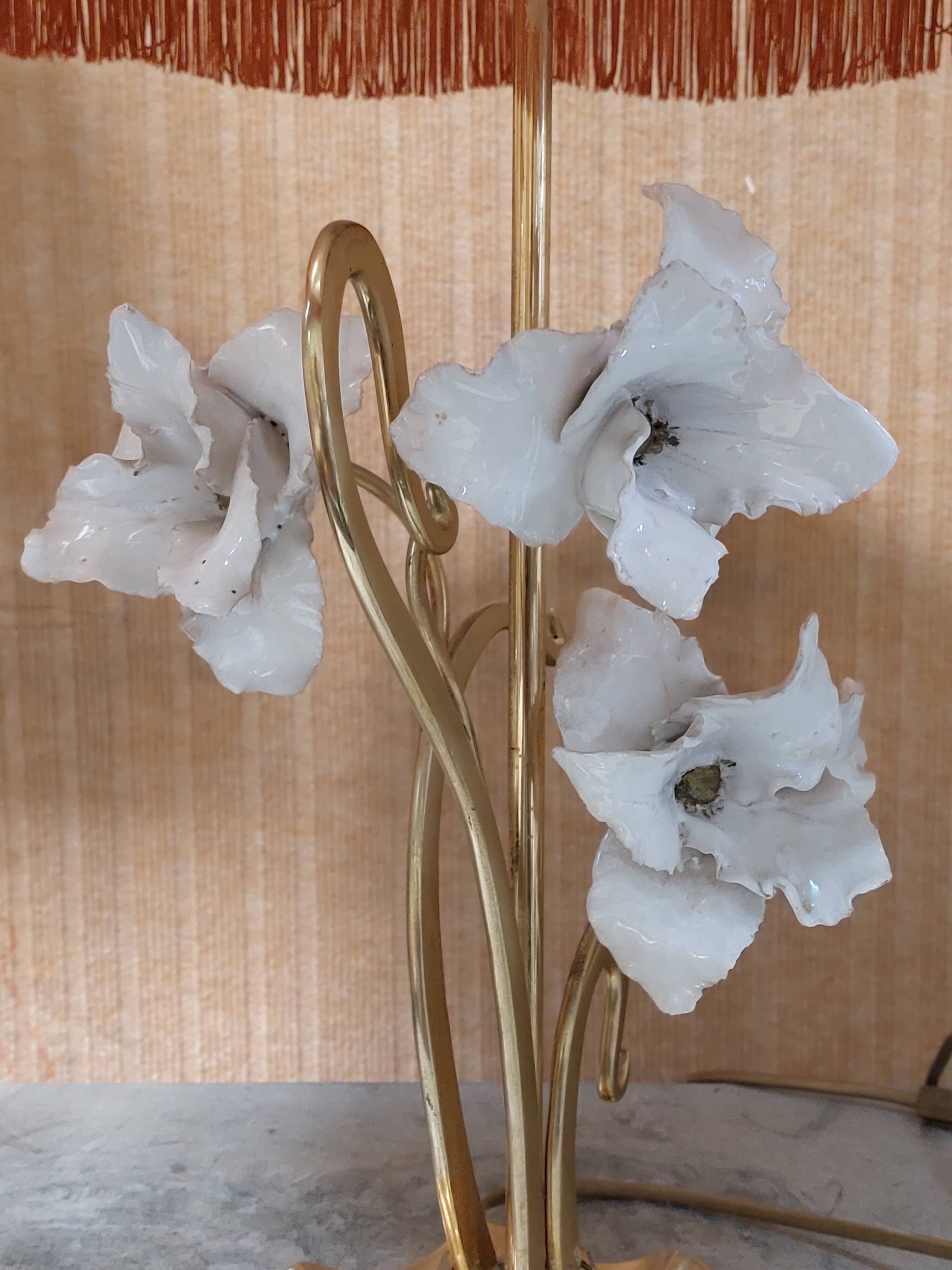 Large gilded brass lamp with white porcelain fleur-de-lis decoration