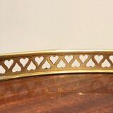 Round brass and mahogany sofa end from Jansen