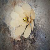 Flower wall light made of rattan and sand linen petals