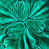 Plate with botanical leaves in green enameled earthenware from Clairfontaine circa 1890