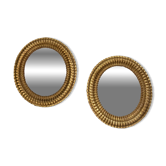 Pair of antique oval mirrors gilded with gold leaf and mercury.