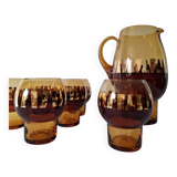 Carafe and its amber/gold glasses from the 70s