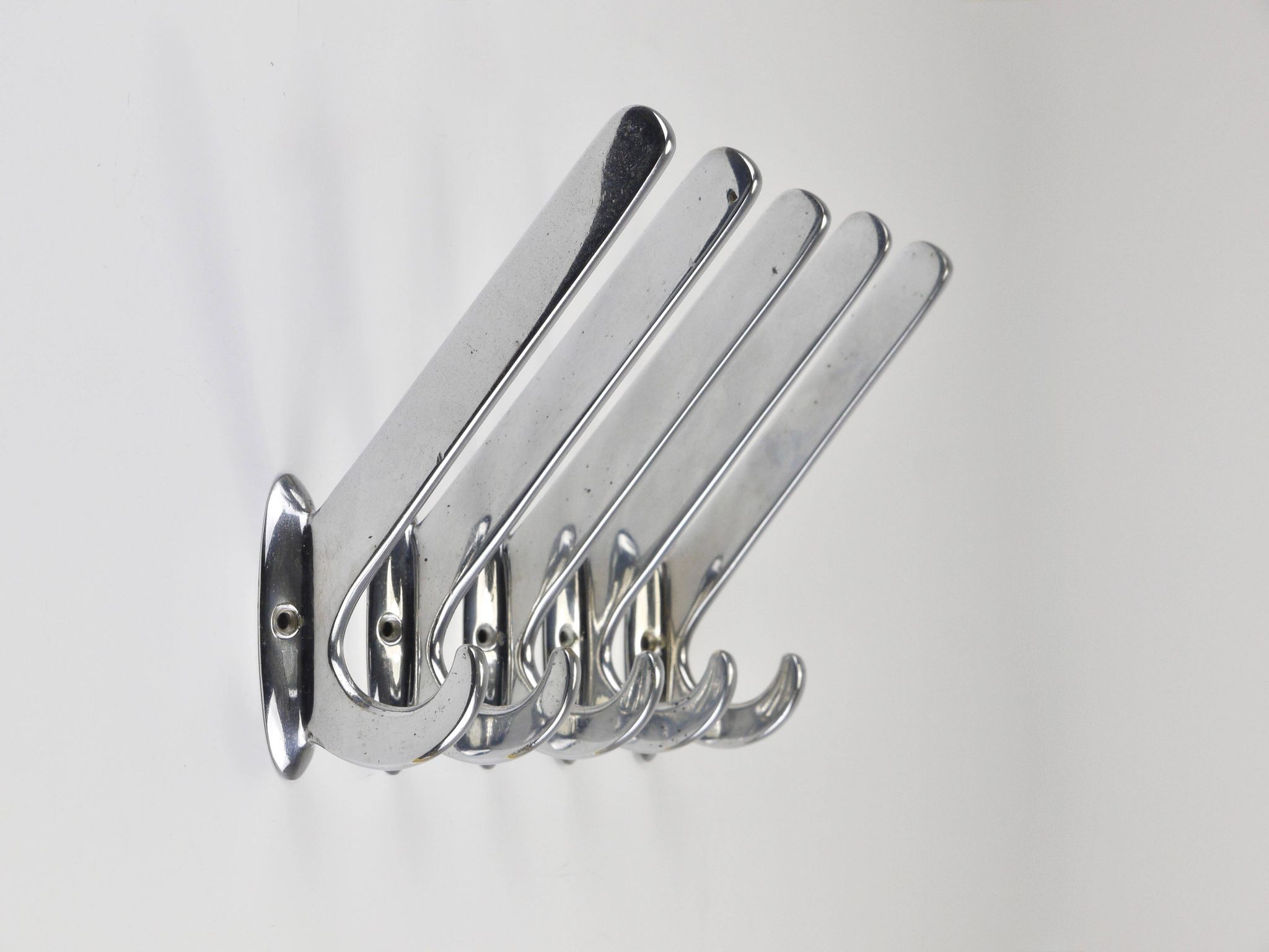 Up to 5 large Art Deco Bauhaus wall hooks in nickel and brass, Vienna, 1930s.