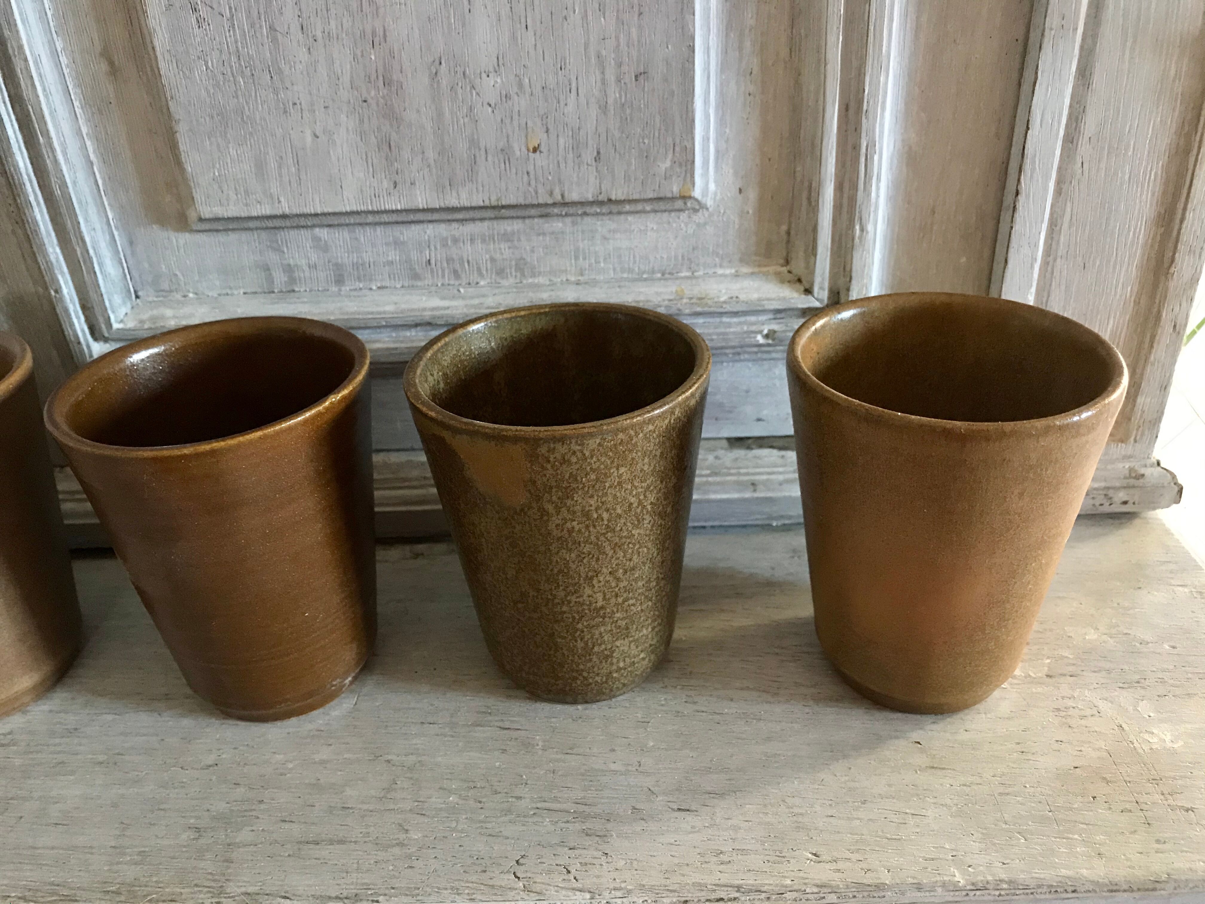 Lot of six Digoin mugs in sandstone