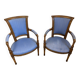 Paire de fauteuils de style Louis XVI en bois sculpté