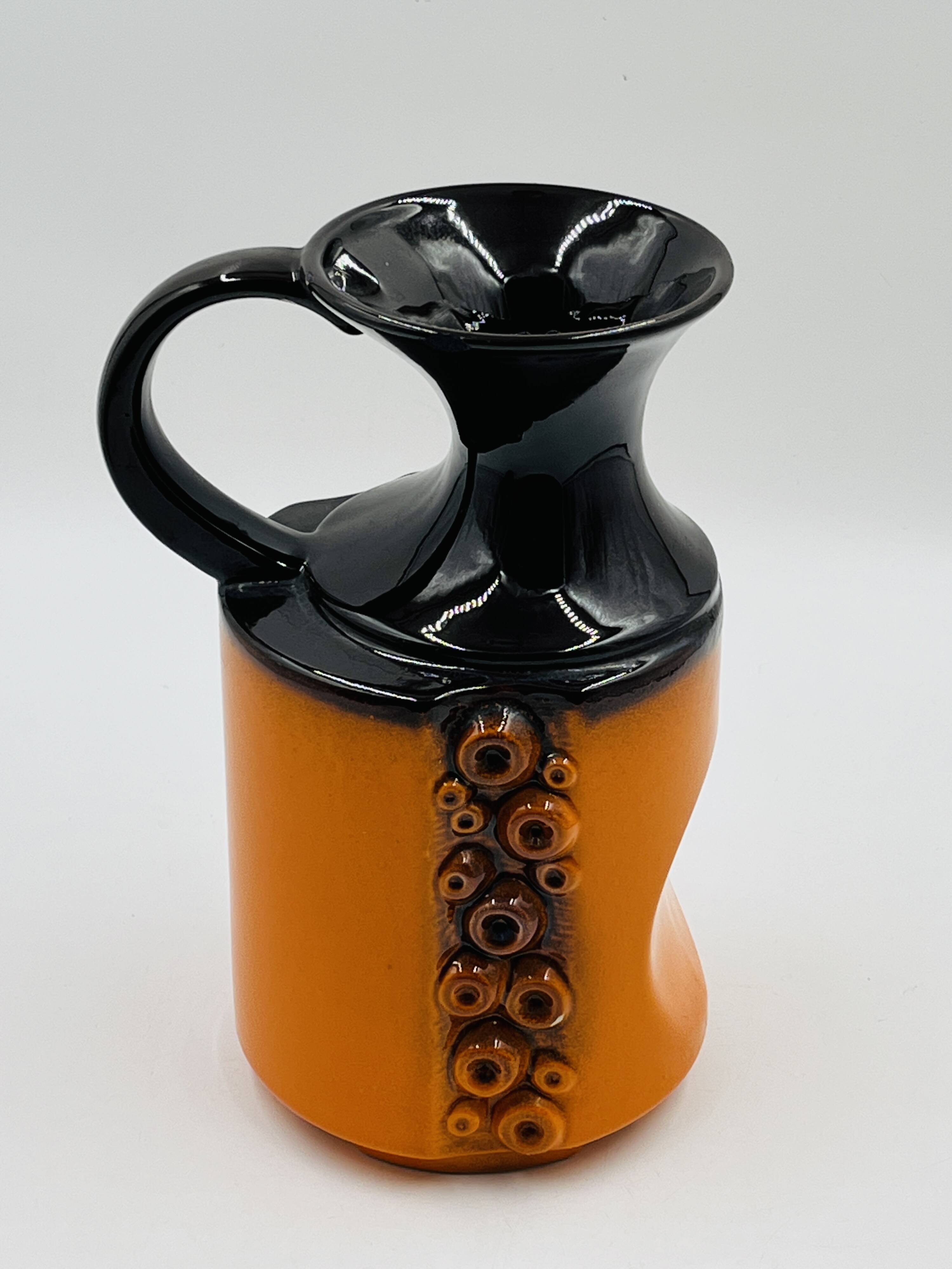 Modernist vase design, orange ceramic with relief cabochons from the 1970s.