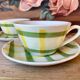 Two yellow and green Moulin des Loups Glasgow teacups