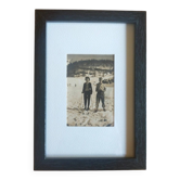 Framed vintage photograph of skiers.
