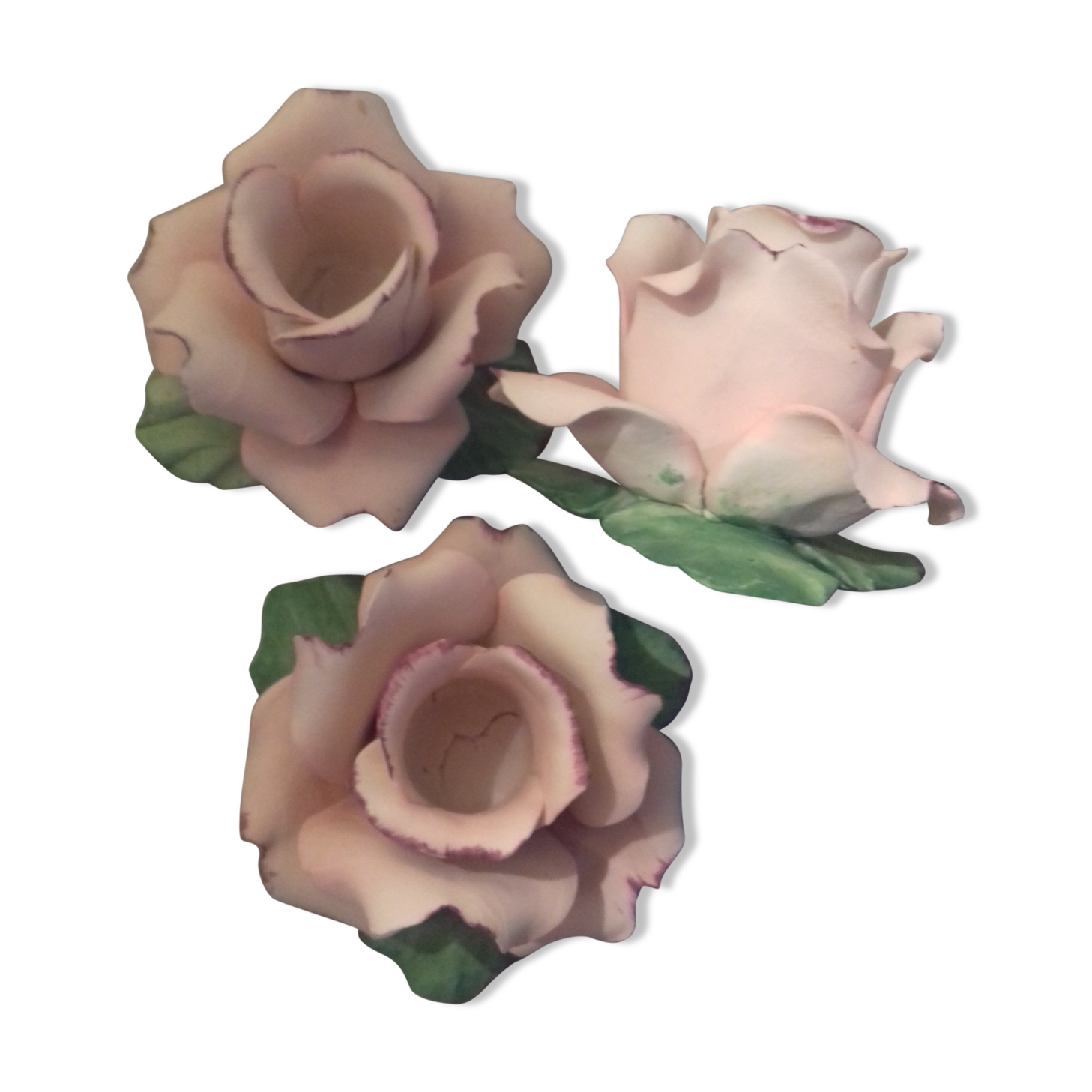 Suite of three omani pink candlesticks