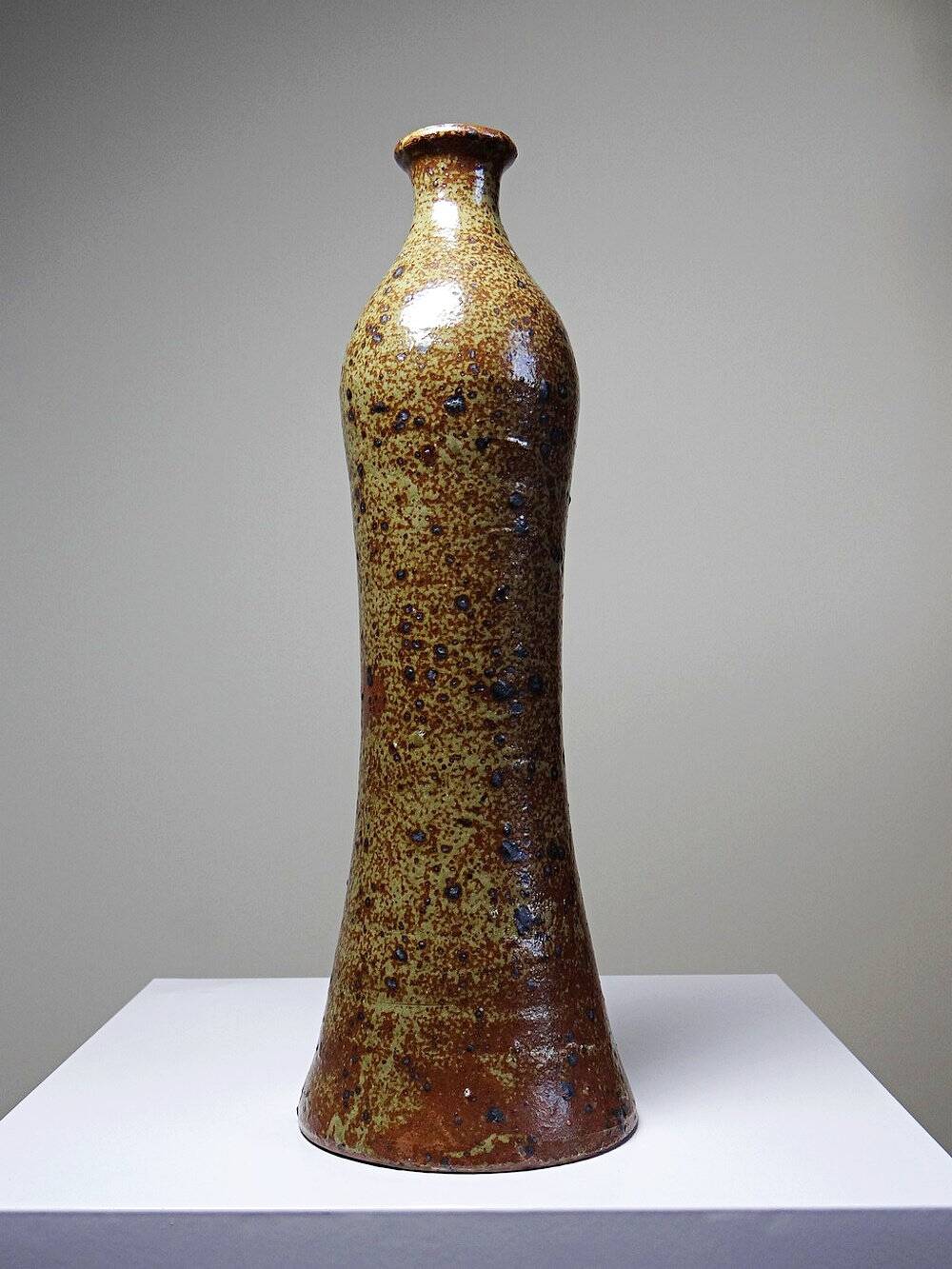 Tall bottle or soliflore in vintage handcrafted enamelled pyrite stoneware from the 60s and 70s