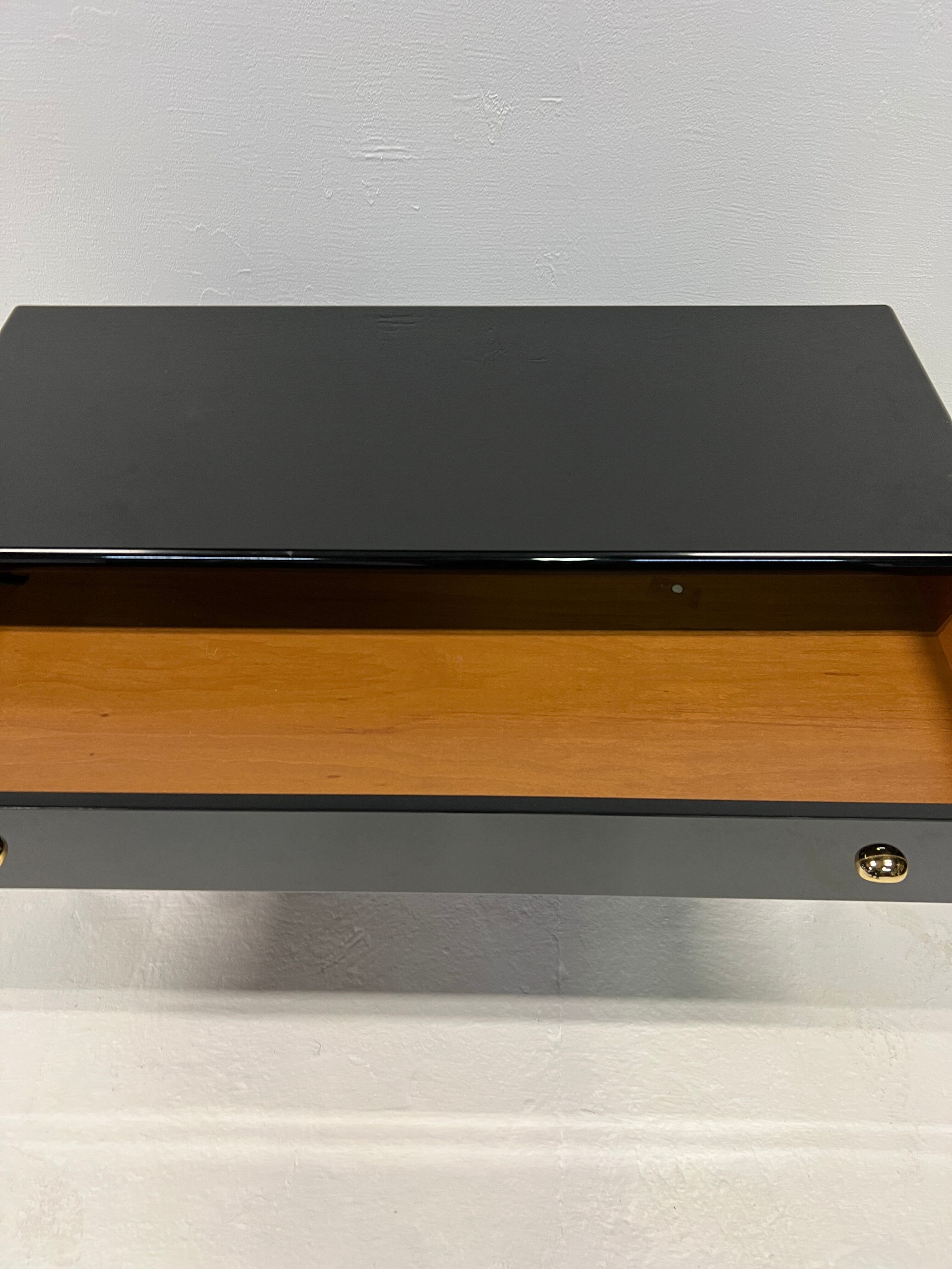 Black lacquered chest of drawers
