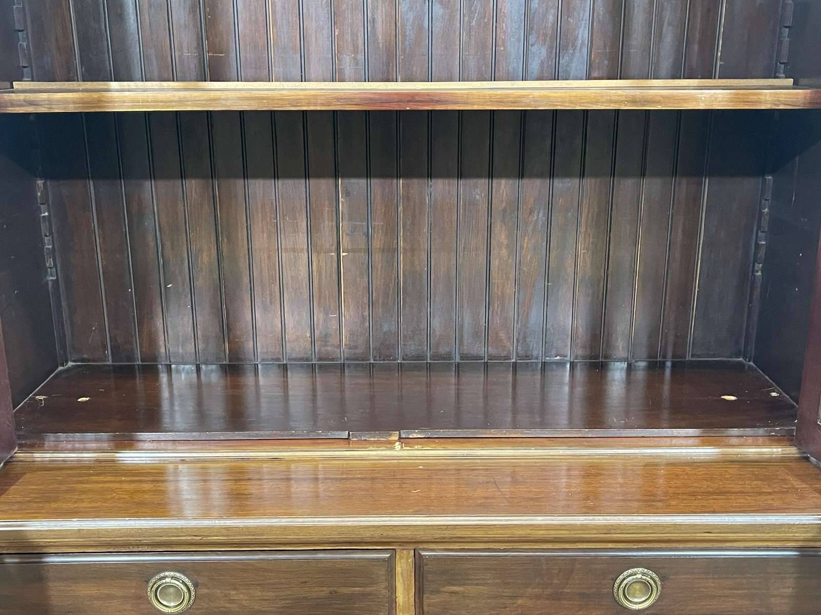 English walnut two-body library from the early 20th century.