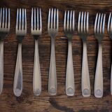 Mismatched set of 8 forks + 8 vintage shell stainless steel knives
