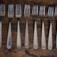 Mismatched set of 8 forks + 8 vintage shell stainless steel knives