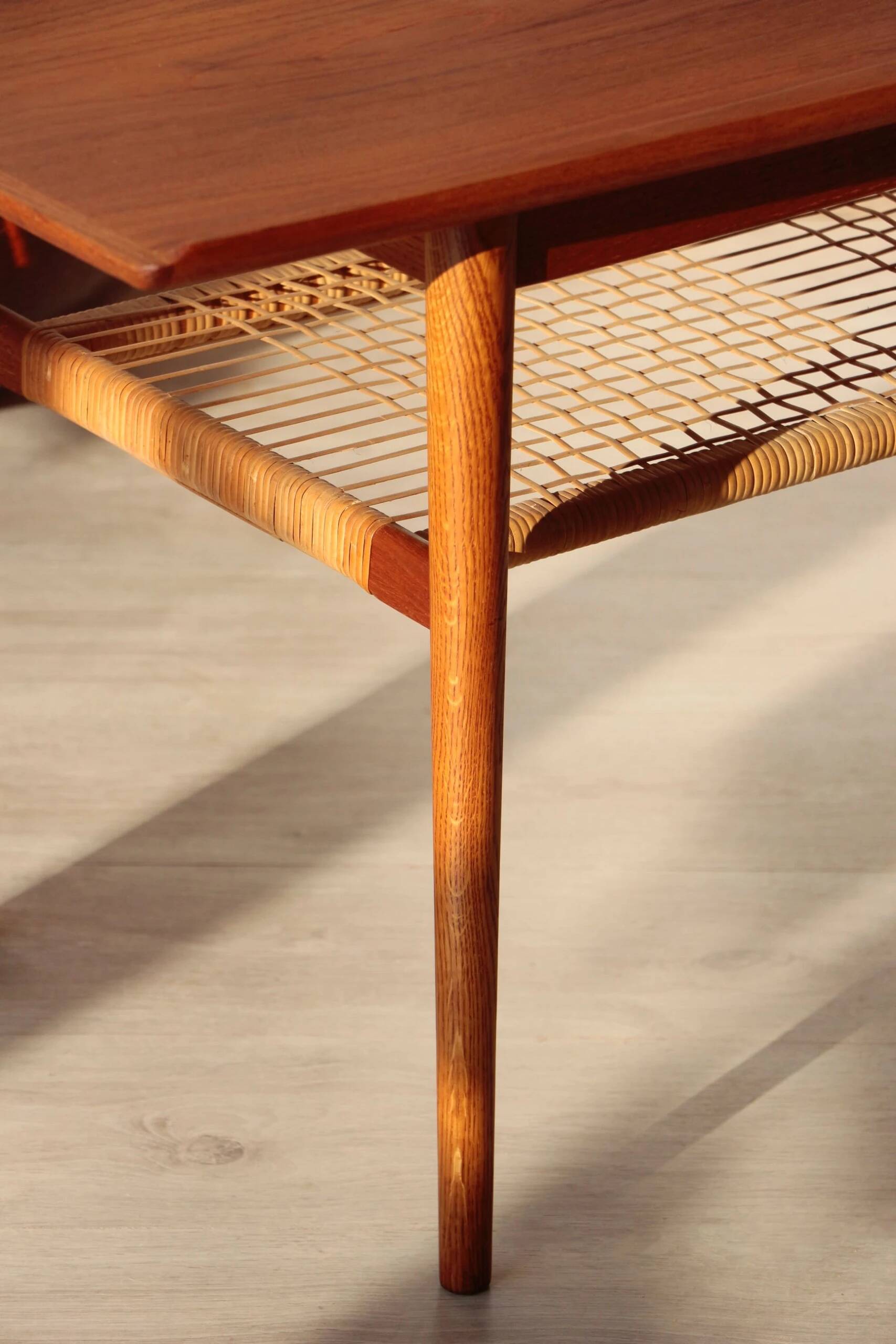 Vintage Scandinavian coffee table in teak and rattan – Danish design from the 1960s.