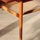 Vintage Scandinavian coffee table in teak and rattan – Danish design from the 1960s.